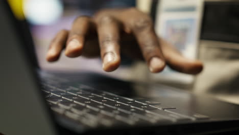 vertical video engineer in smart factory oversees robotic assembly lines using laptop software