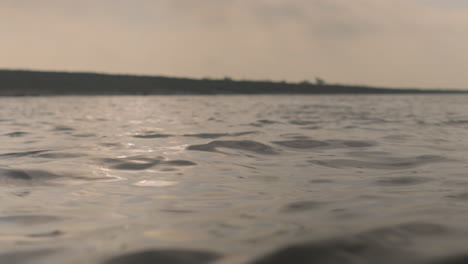 River-water-flow-shot-from-low-angle-4k-422-10-bit-stock-footage--Bangladeshi-river