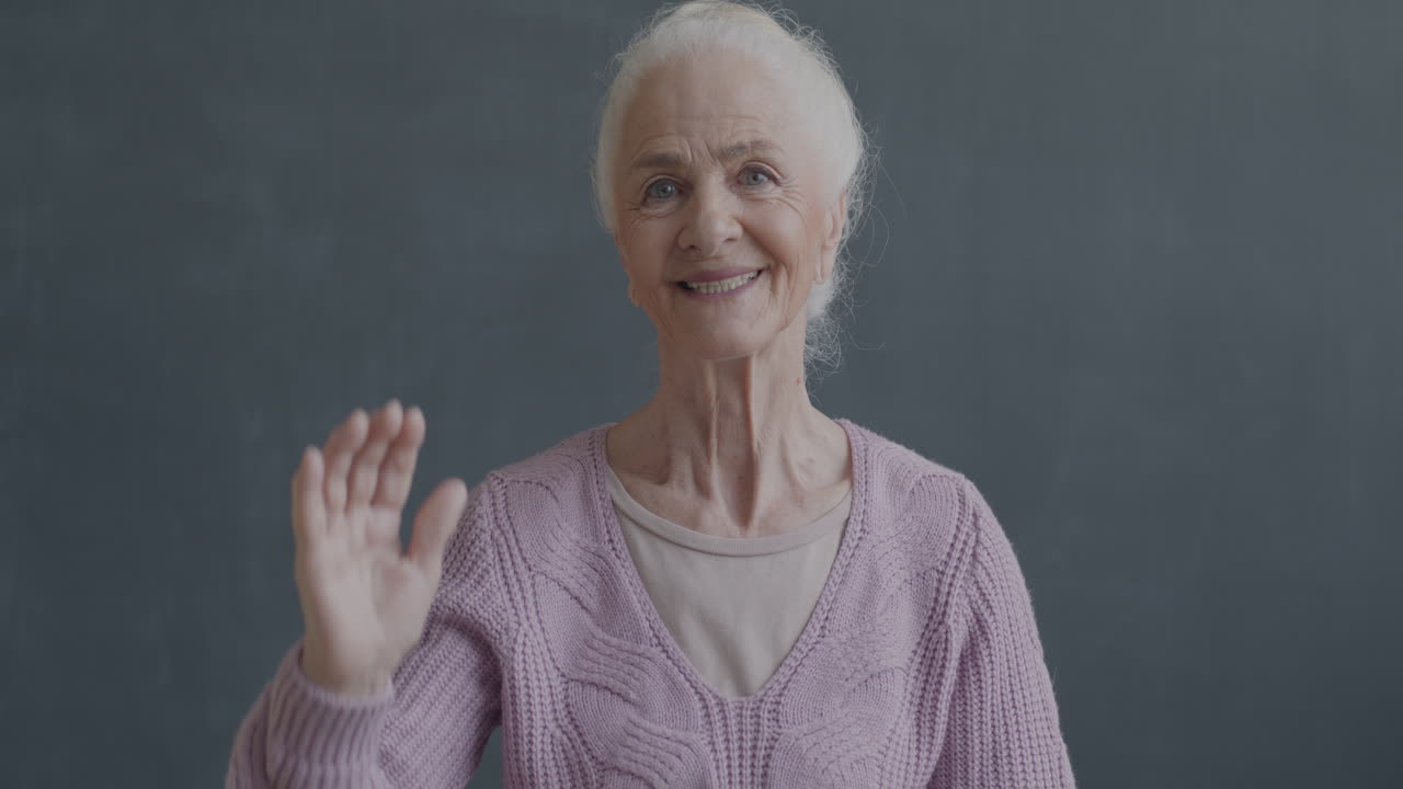 Smiling Senior Woman Waving