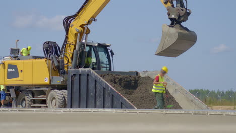 concrete paving machine building a cement road