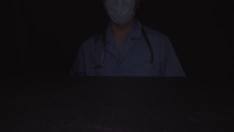 doctor hand throws light pills onto black surface closeup