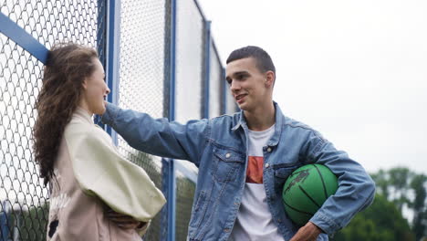 teenagers talking outdoors