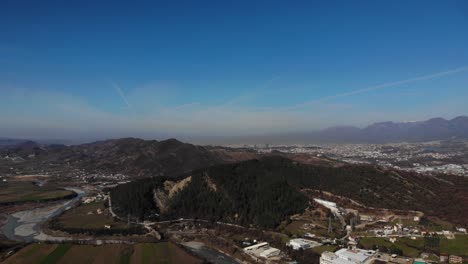 Panoramic-view-of-hills,-river-streaming,-fields-and-villages-near-Tirana,-Albania