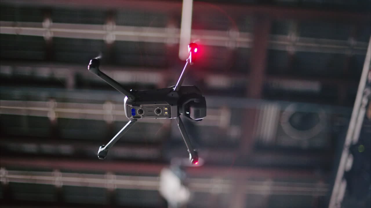 Drone flying and filming near flashing studio lights and camera equipment on a TV set