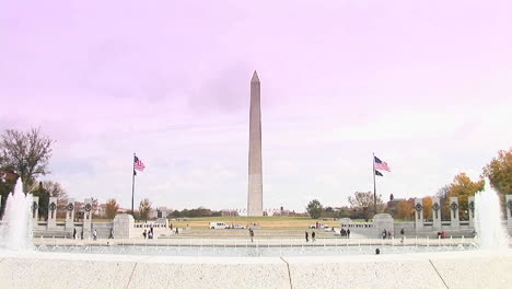 the washington monument with the national world war 2 memorial foreground