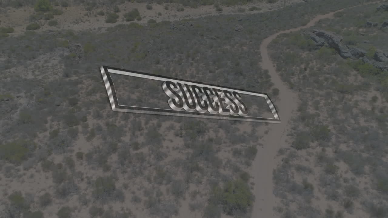Success text animation over aerial view of desert landscape with winding path
