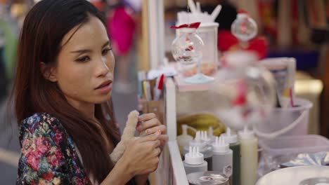 woman shopping at a street food stall