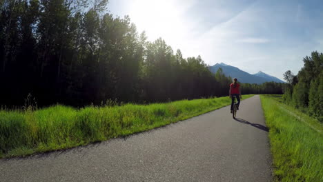 woman riding unicycle on road 4k