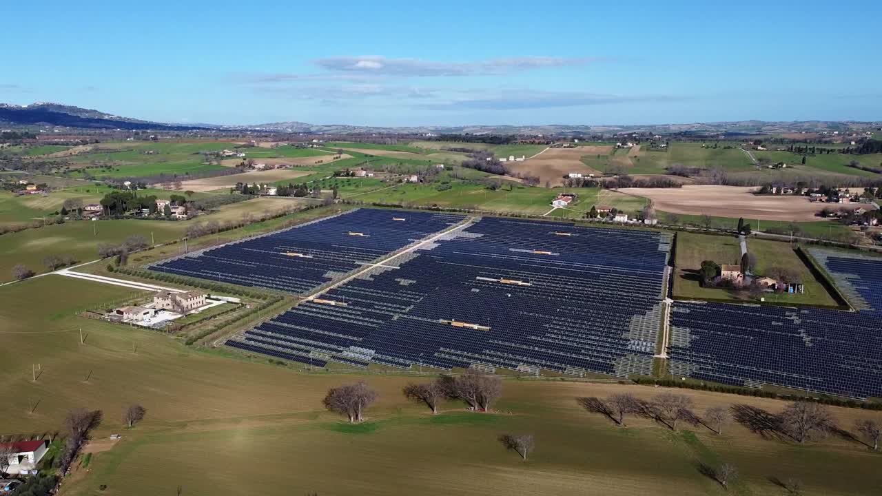 aerial view of photovoltaic power plant in a sunny day in the italian countryside