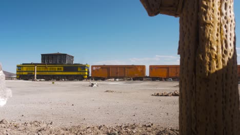 freight train traveling through the julaca’s ancient train station in potosi, bolivia