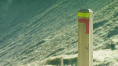 Focus pull to a hiking route marker post