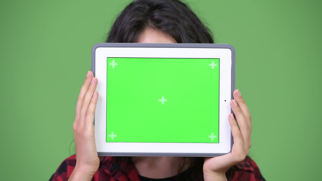 Young beautiful businesswoman showing digital tablet