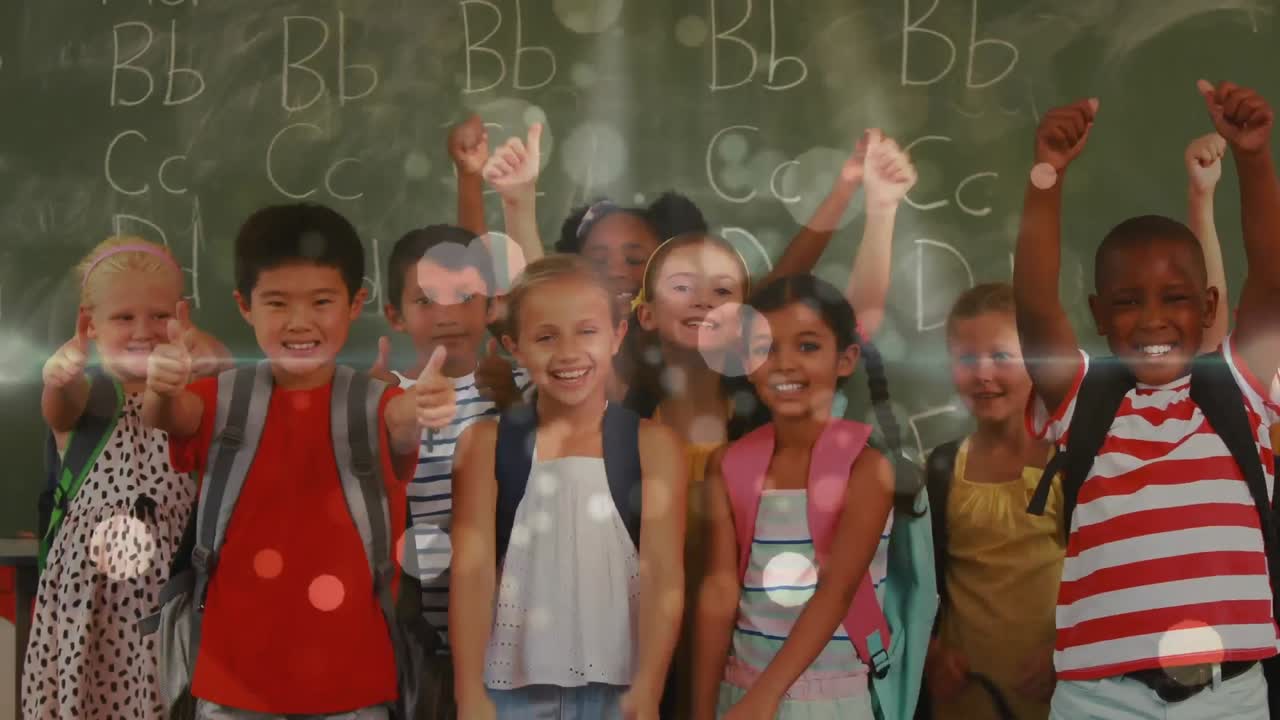 Pupils smiling and raising thumb in class