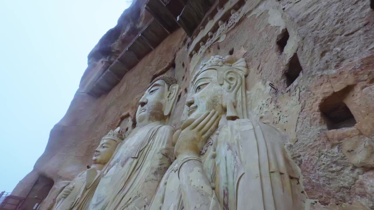 Huge Buddha Sculptures On The Cliff Of Maijishan Grottoes In Tianshui, Gansu Province, Northwest China. Pan Down Closeup Shot
