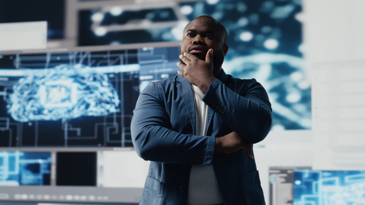 Black programmer expert engaging in software development at high tech workspace