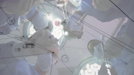 performing operation, surgeons with medical data processing animation over surgical scene