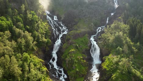 Latefossen-is-one-of-the-most-visited-waterfalls-in-Norway-and-is-located-near-Skare-and-Odda-in-the-region-Hordaland,-Norway.-Consists-of-two-separate-streams-flowing-down-from-the-lake-Lotevatnet.