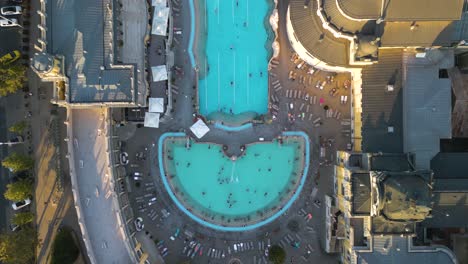 cinematic drone flight above szechenyi thermal baths in budapest on typical day