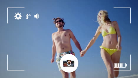 tomando fotos de una pareja con una cámara digital