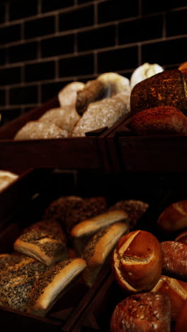 assorted breads and rolls in a wooden crate