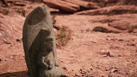 Ancient-Statue-on-the-Rocks-Desert