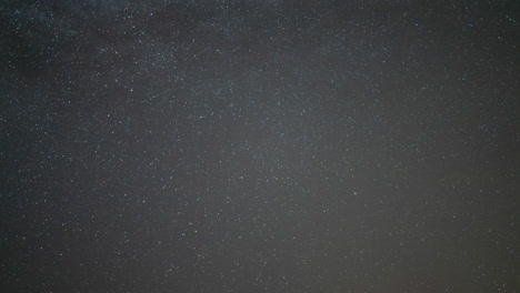 starry night sky timelapse showing the rotation of celestial bodies around polaris