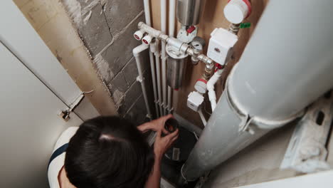 plumber fixing water tubes