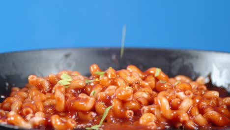 boiled pasta cavatappi with tomato sauce in the pan.