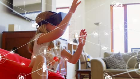 Animation-of-network-of-connections-with-icons-over-girl-wearing-vr-headset