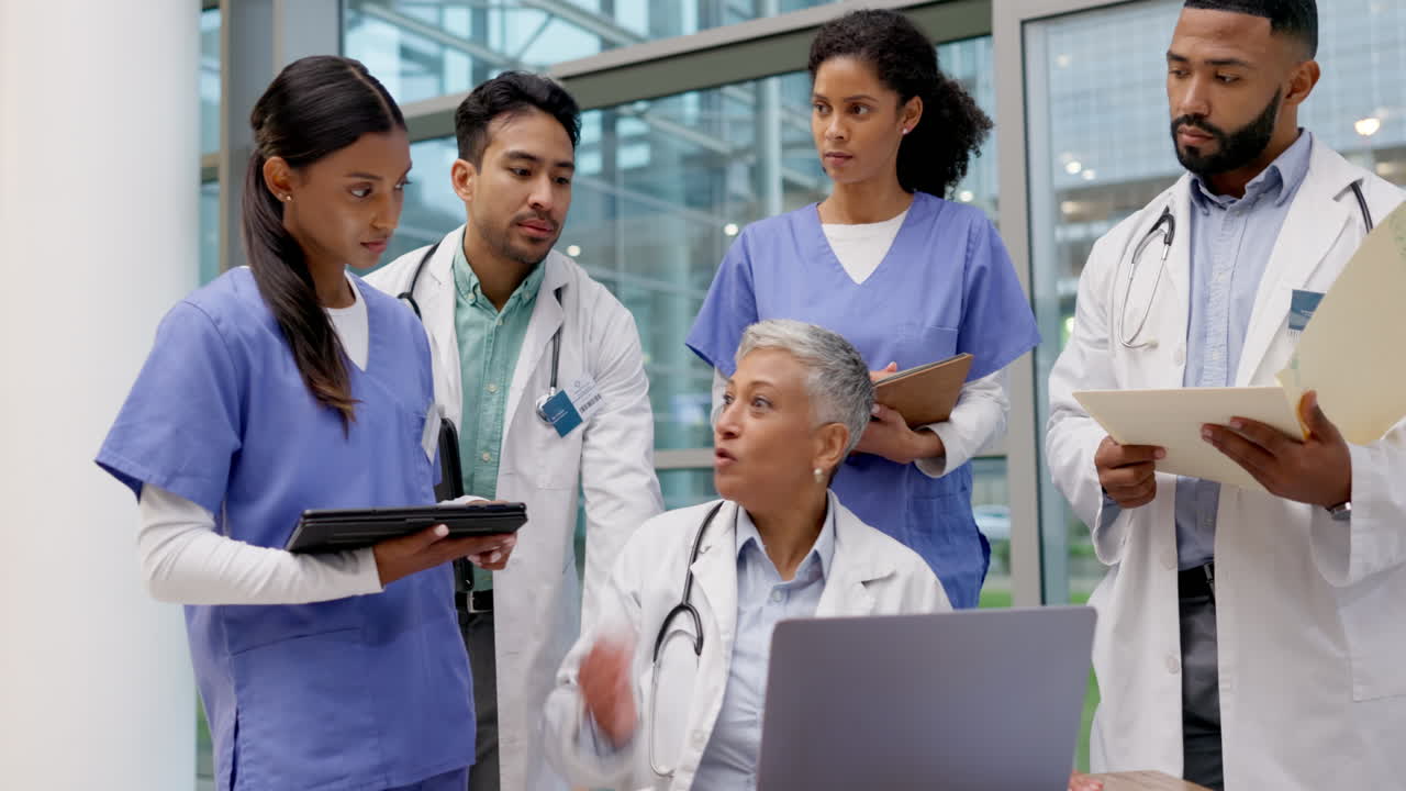 Angry, laptop and team of doctors in meeting