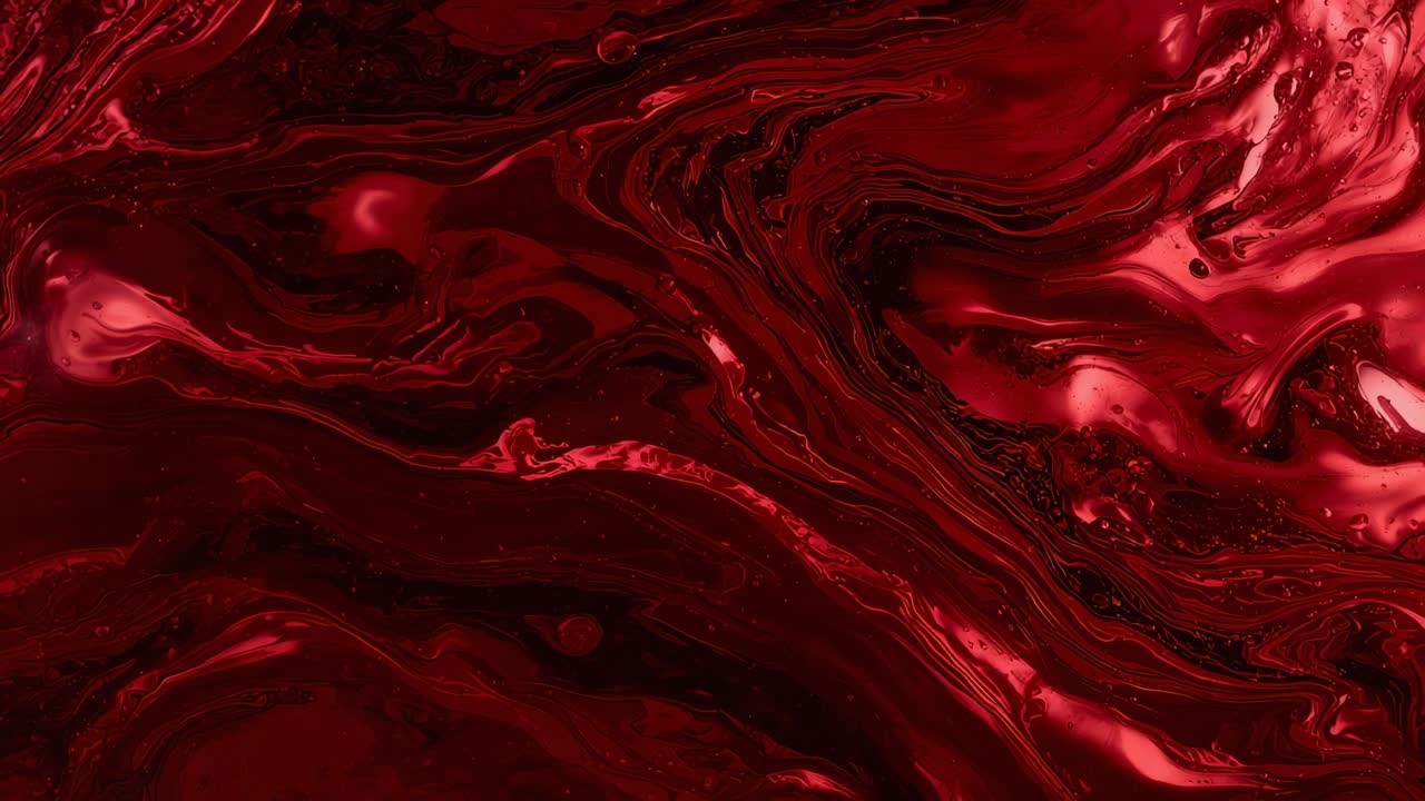 Shifting glossy marbled red fluid reacting to studio light, settling into flowing veins and bubbles