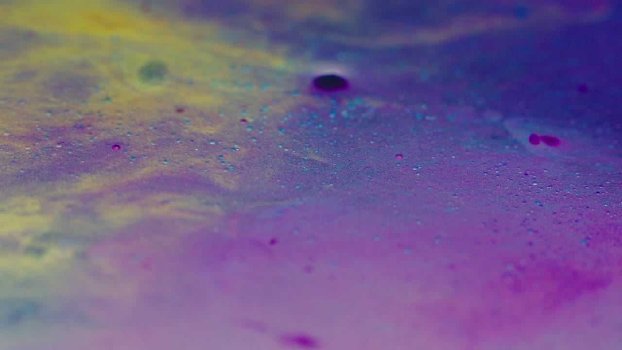 Colourful, organic, liquids macro shots buzzing and flowing