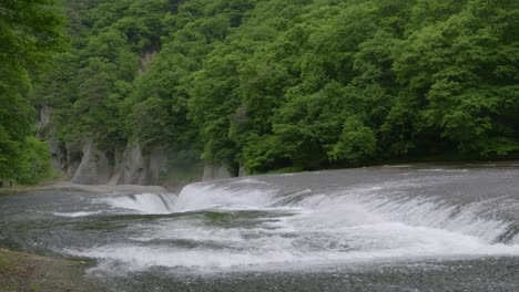 massive scale of wide waterfalls compared to people