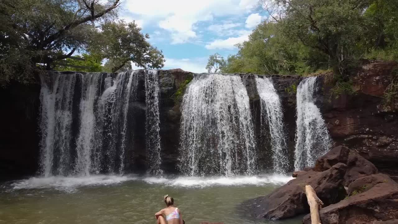 Cinematic aerial shot of Waterfall in the topical forest in Misiones, Argentina's forest