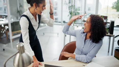 businesswomen celebrating success in the office