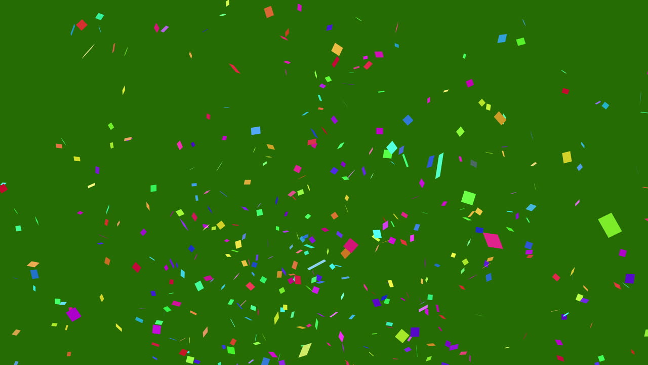 Coriandoli in vivaci colori classici esplodono dal basso dello schermo verde e ricadono fuori dall'inquadratura.
