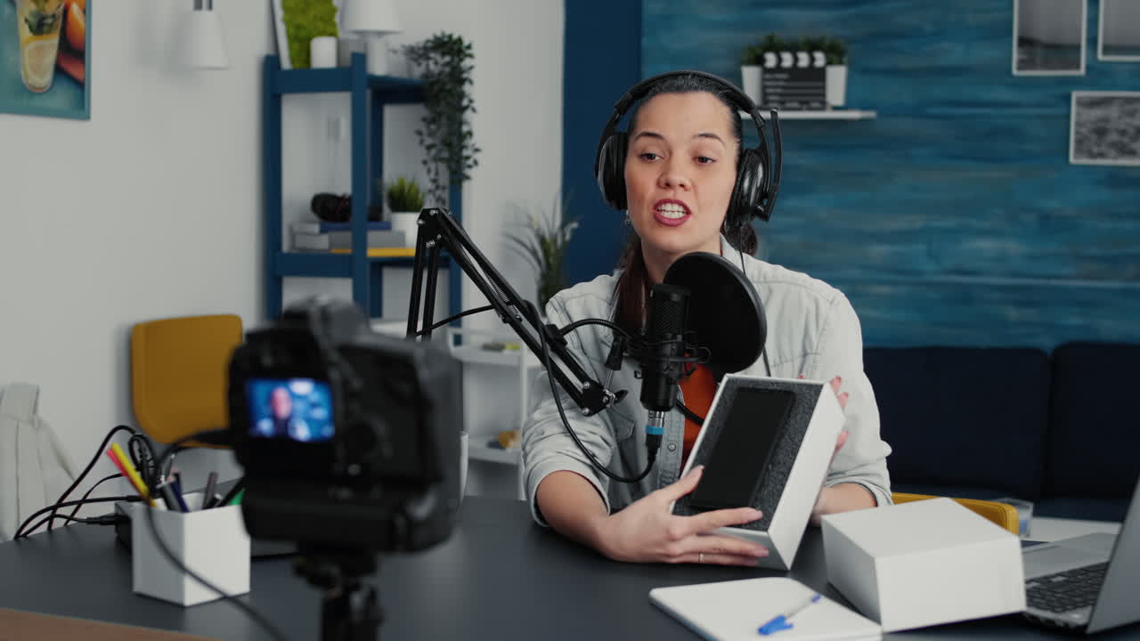 Popular internet influencer doing unpacking video of modern smartphone