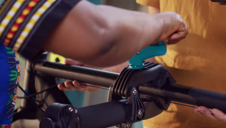 couple placing bicycle to repair-stand