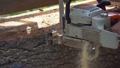 slow-motion-close-up-of-an-alaskan-mill-creating-sawdust-at-a-homestead