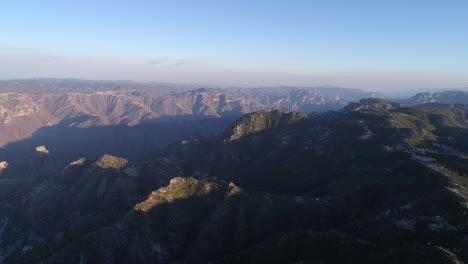 Aerial-drone-shot-of-the-epic-Urique-Canyon-at-sunset-in-Divisadero,-Copper-Canyon-Region,-Chihuahua