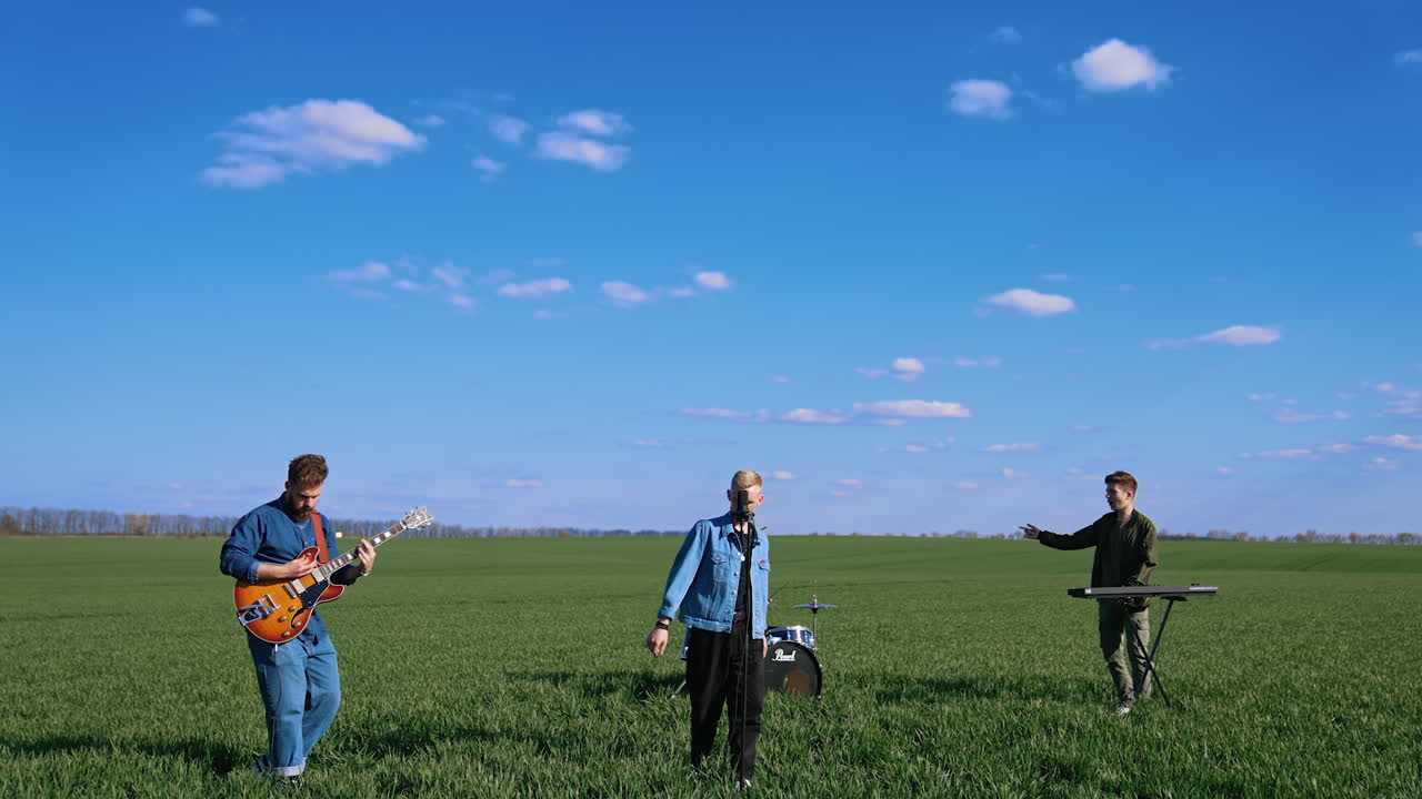 Music performance on field. Music band performing with singer on field