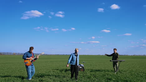 music performance on field. music band performing with singer on field