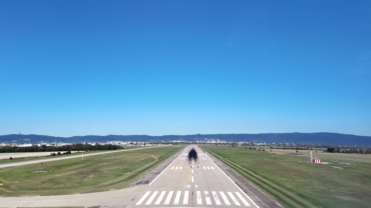 An Immersive pilot’s perspective from a jet airplane cockpit in a real time landing on a single long runway, in a bright summer morning.