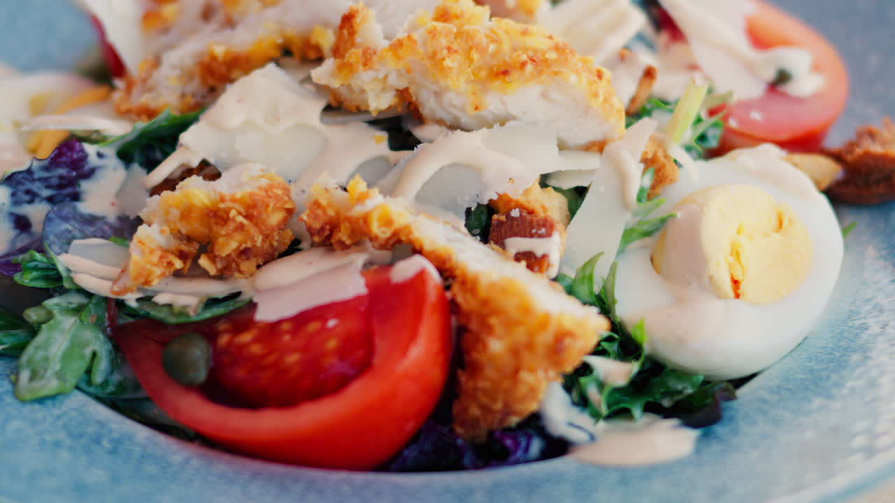 Close up of a caesar salad on a plate at a restaurant