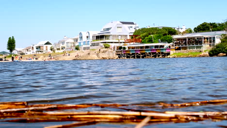 low angle view over onrus lagoon of colorful restaurant overlooking water