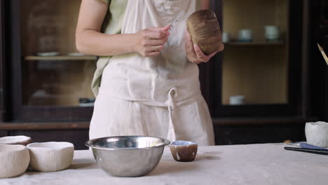 woman ceramic artist working on pottery