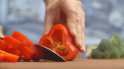 red pepper cut on a wooden board close-up. shred.