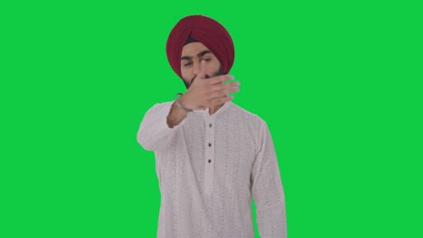 angry sikh indian man stopping someone green screen