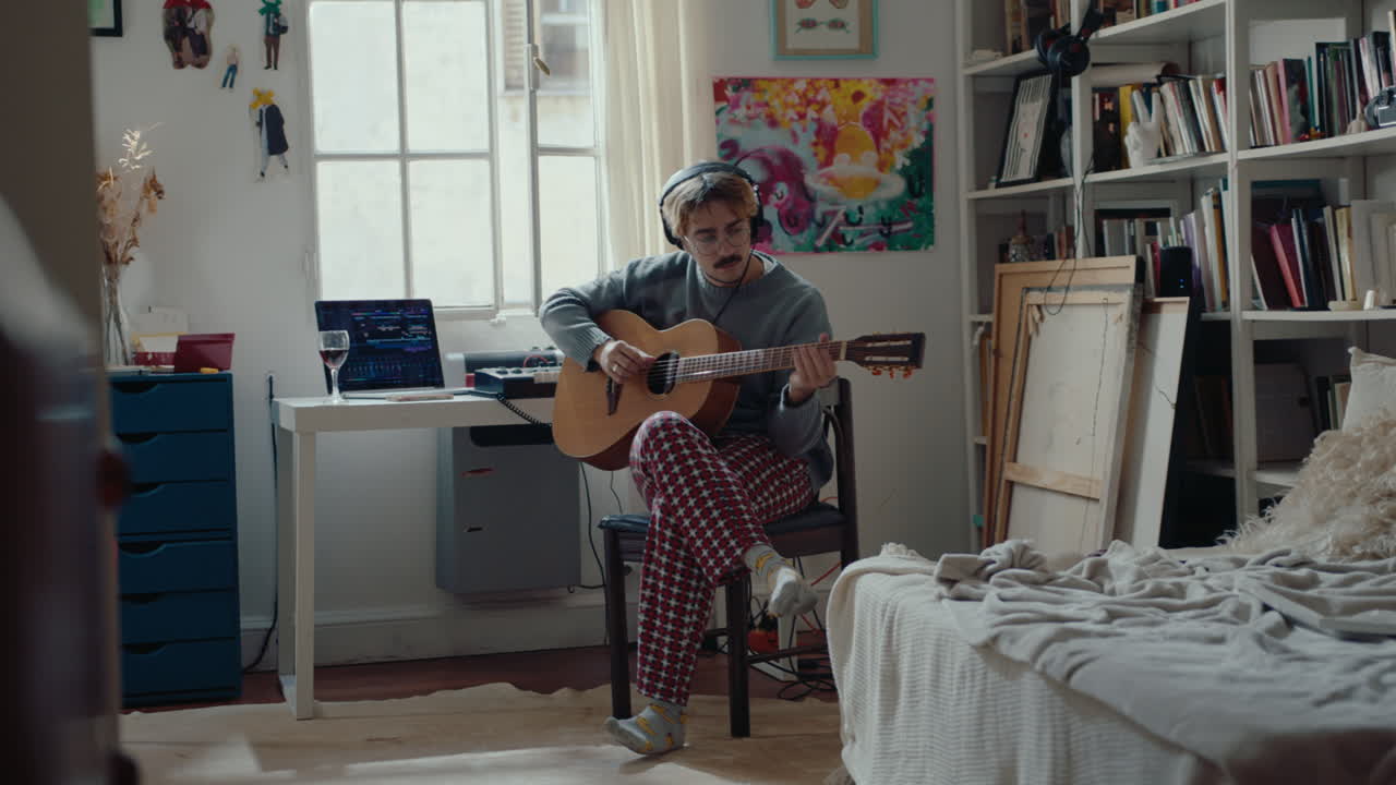 Guitarist Playing the Music at Home Recording Studio