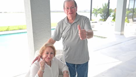 happy husband and wife customers of a new pool outdoor area